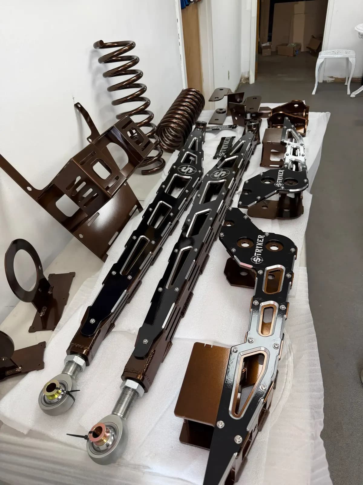 Set of suspension parts powder coated in bronze