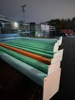 Industrial rollers powder coated in green and orange