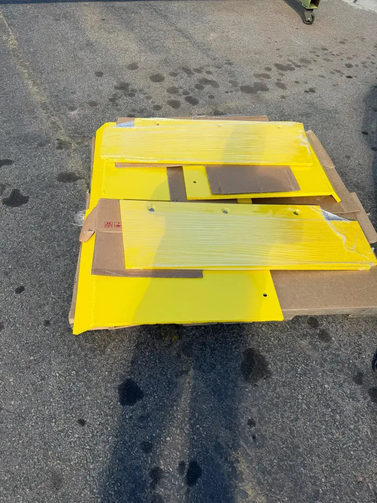 Yellow powder coated steel panels after curing